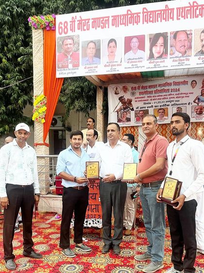 Being felicitated at a regional school athletics meet. My work is dedicated to building the future of athletics in this region.
