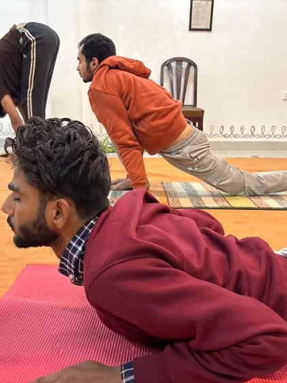 Participants move through the dynamic postures of Surya Kriya, a practice designed for well-being on all levels.