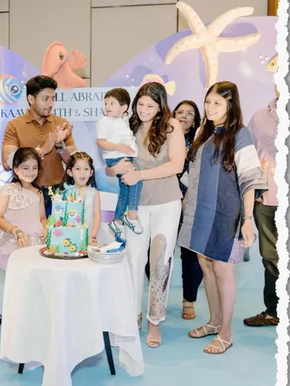 Capturing the happy moments! A family celebrates with their children in front of our beautiful underwater-themed party setup.