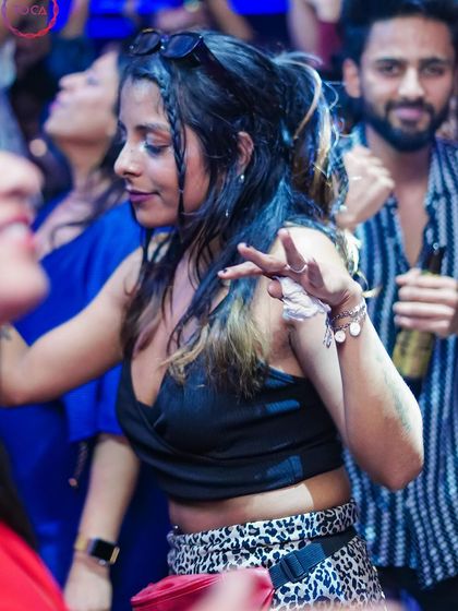 A guest dancing in the crowd.