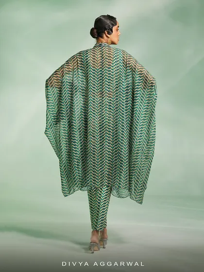 The back view of the green Riley Kaftan Set, showing the full, dramatic spread of the lightweight, printed fabric.
