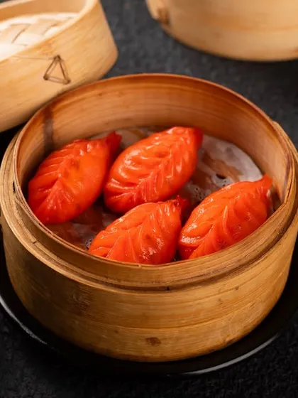 These vibrant red, leaf-shaped dumplings are visually striking. A unique item like this needs a high-quality photo to encourage customers to try something new.