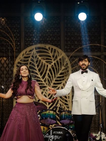 The couple striking a pose at the end of their dance performance.