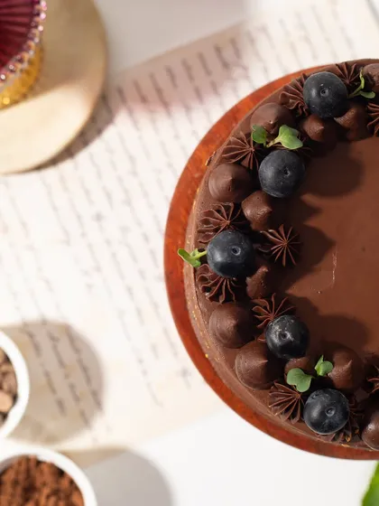 An artistic top-down shot of the chocolate and berry cake, showing the beautiful contrast of colors and textures.