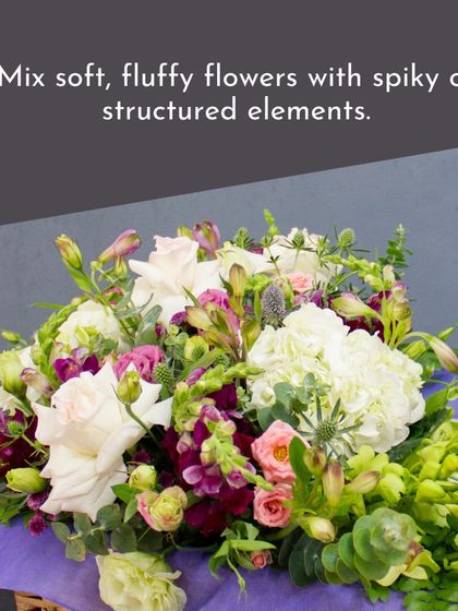 This bouquet is a great example of mixing soft, fluffy flowers like hydrangea with more structured elements to create a rich, textured look.