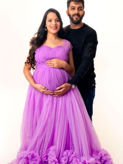 A classic couple's portrait with the mom-to-be in our beautiful lavender ruffled gown.