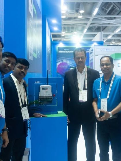 My team posing with visitors and partners at the ELECRAMA 2025 expo.