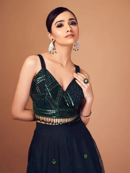 Emerald and sequins make for a dramatic combination. I created a sharp, dark smoky eye to match the intensity of this gorgeous green and black outfit.