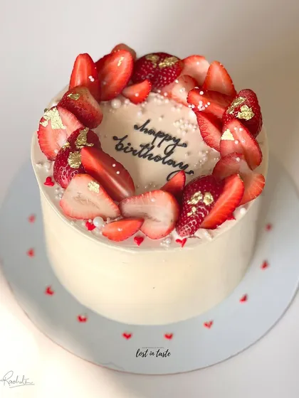 A seasonal favorite, this Vanilla Strawberry cake is topped with fresh strawberries, edible gold leaf, and tiny sugar pearls. It's available as a celebration cake or a smaller bento cake.