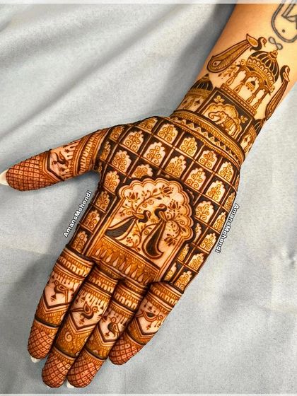 A stunning grid-based design filled with peacocks and palace windows. The central motif on the palm is a beautiful dancing peacock.