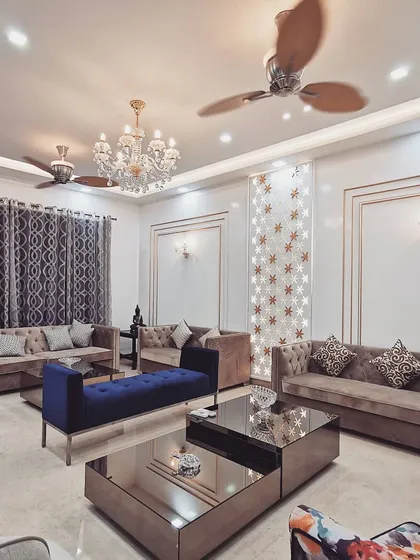 The formal living room of Villa 9/21B, where classic luxury meets contemporary comfort. We designed this space with custom furniture, intricate wall paneling, and layered lighting to create an environment of sophisticated elegance for both family life and entertaining.