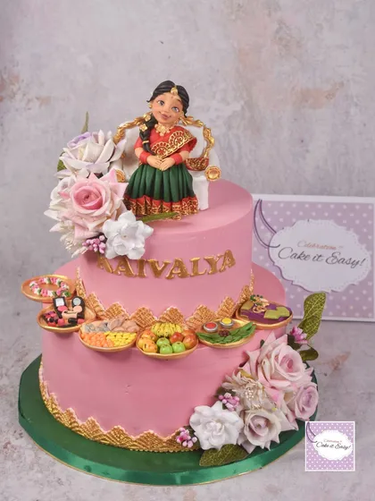This was my first time making a cake for a half-saree function, a beautiful coming-of-age ceremony. The design was inspired by a master cake artist, and it was a joy to recreate the intricate details.