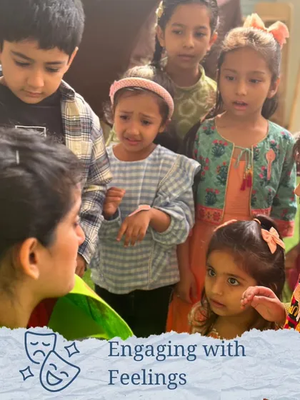 A facilitator helps children engage with their feelings during a story, a key part of developing emotional intelligence through drama.