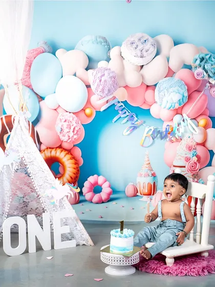 The pure, unfiltered joy of a first birthday cake smash! This is what it's all about: celebrating milestones with laughter, a little bit of mess, and a whole lot of fun in my colorful studio setup.