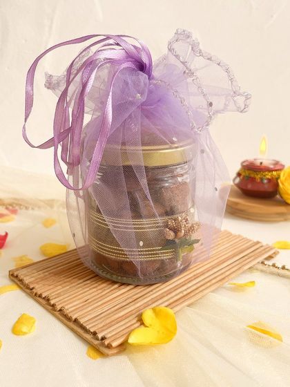 A single jar of our choco almonds, wrapped in festive purple organza, perfect as a small Diwali favor or add-on.
