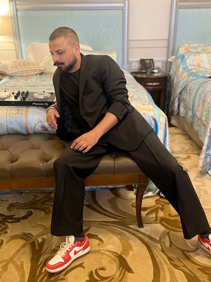 Setting up for a high-profile event at the Versace in Dubai. For destination weddings, I bring my professional Pioneer console to ensure flawless sound quality, no matter where we are in the world.