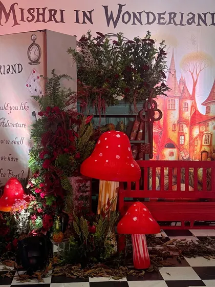 The Wonderland entrance at night, with dramatic lighting enhancing the magical feel.