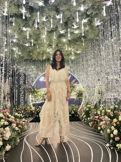 Finding the perfect spot for a photo. The lighting and decor at weddings are often incredible, and I love capturing my look in these beautiful settings.