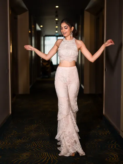 The playful movement of the tiered sharara pants makes this outfit perfect for dancing the night away at a sangeet. It’s a chic and comfortable alternative to a heavy lehenga.
