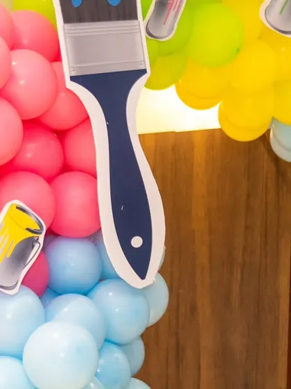 Detail shot of the balloon work for the Art and Paint theme, with paintbrush cut-outs integrated into the balloon column.