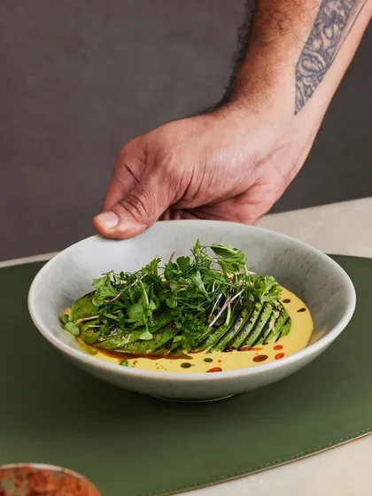 For our vegetarian friends, a dish of poetry and contrast. This is our Torched Avocado Ceviche, where the smokiness of the avocado is balanced by quinoa, crisp cucumber, and a sharp, citrusy passionfruit tiger’s milk.