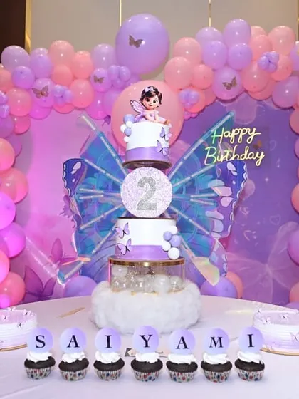 Another view of the beautiful butterfly-themed dessert table, complete with personalized cupcakes.