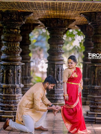 A tender moment in our stone pillar hall, with the groom-to-be adjusting his bride's jewelry.
