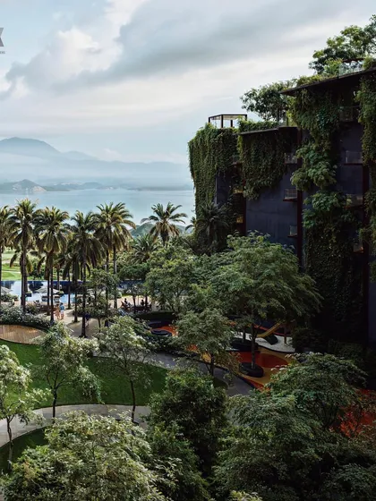 A wide-angle view of the Westin Nashik, showing how the hotel is nestled into the landscape. The design prioritizes a deep connection with nature, offering a luxurious escape from the everyday.
