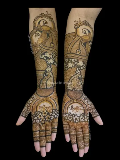 A full view of the fish motif design, showing how it is mirrored on both hands. The palms feature a unique design with love birds and initials.