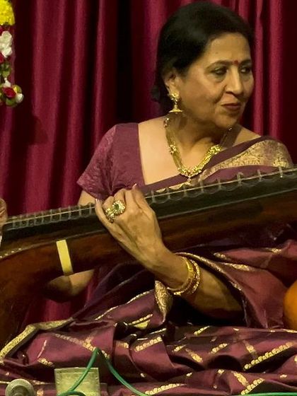 A close-up of me, completely absorbed in the music. This is my world, where every note from the veena tells a story.