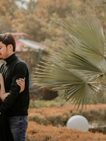 A tender forehead kiss is a timeless expression of love and care. It's a must-have shot for any couple's maternity session.