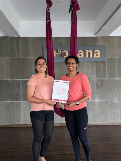 Two of our students, one an instructor and one a new graduate, share a moment of connection after the course completion.