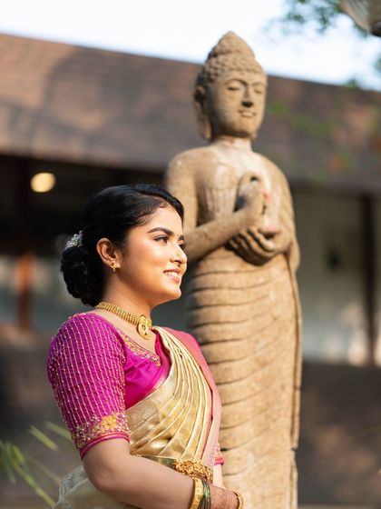 A serene portrait of the bride. The makeup is soft and natural, and the elegant updo completes the polished look.