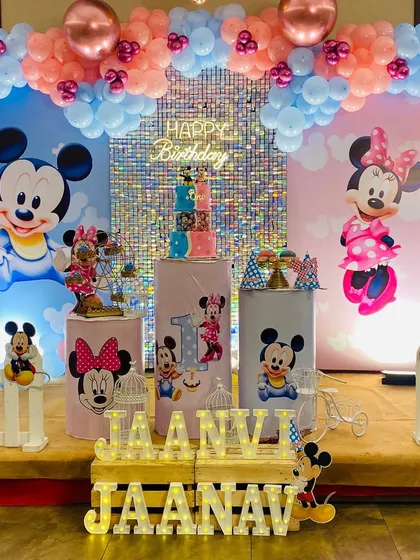 Full view of the adorable Mickey and Minnie Mouse themed stage decoration, perfect for celebrating twins or any Disney fan.
