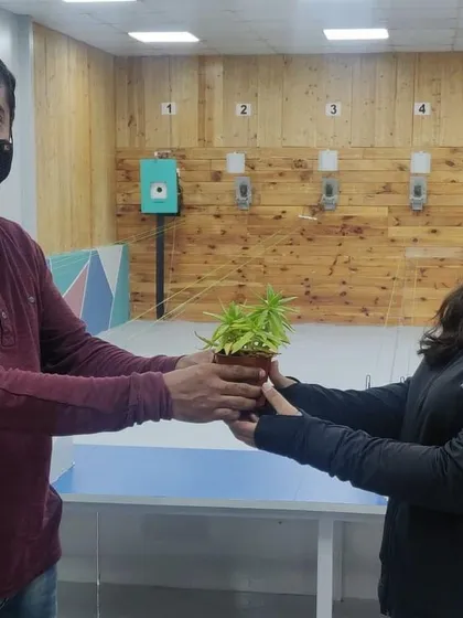 Another moment from our plant gifting ceremony, fostering a positive and encouraging atmosphere.