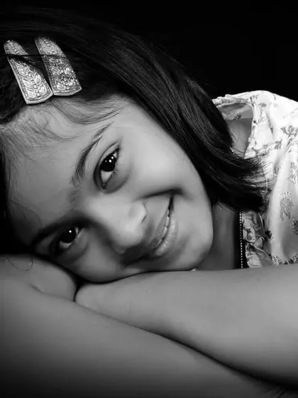 A sweet and simple black and white portrait of a young girl. This timeless style focuses on expression and creates a beautiful, classic photograph.
