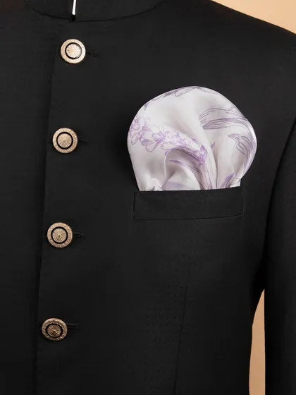 The lavender floral pocket square folded into a jacket, showing its subtle and elegant appearance.