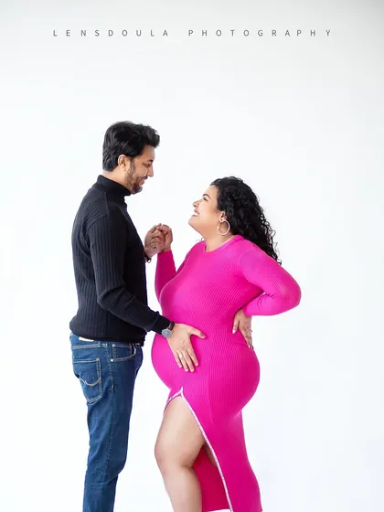 A pop of vibrant color can bring so much energy to a shoot. This bright pink dress against a clean white background is modern and joyful.