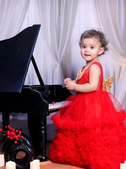 An elegant portrait session featuring our miniature grand piano prop. We can create a classic and sophisticated look for your child's milestone photoshoot.