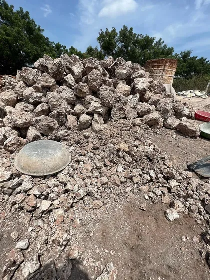 A pile of processed quicklime (calcium oxide) at the kiln site. This material will be carefully slaked with water to create the lime putty that forms the base of our strong, breathable, and long-lasting plasters and mortars.