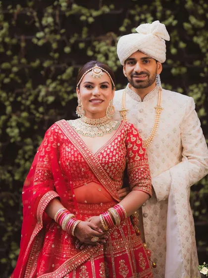 This portrait showcases the couple's happiness. The bride's makeup is subtle yet stunning, with a focus on a radiant complexion and soft eye makeup.