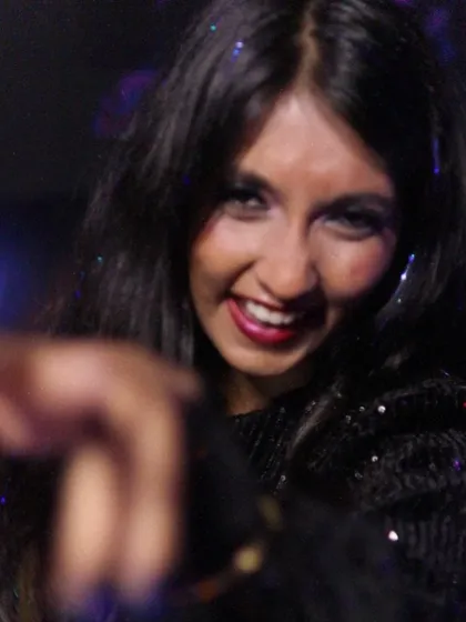 A close-up shot of me smiling and pointing at the camera. This is the connection I build with my audience, making everyone feel like part of the show.