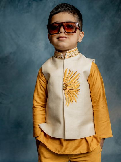 Another look at our sunflower Bundi set, this time with the model wearing sunglasses. It’s a fun, stylish, and confident look for any little boy.