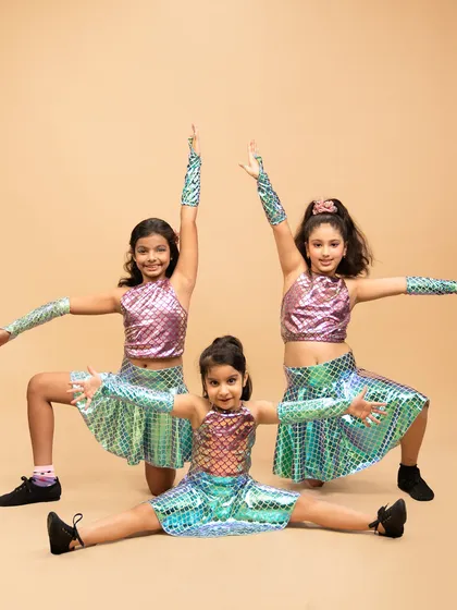 The pure joy of our youngest performers in their "Mermaid Party" jazz routine. Our kids' classes are all about having fun, building confidence, and creating magical memories on stage.