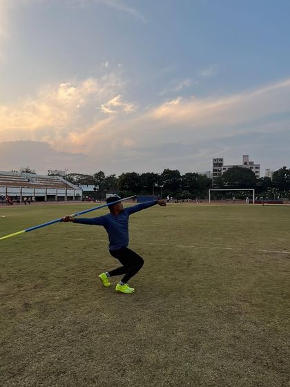 A javelin thrower prepares to launch, showcasing the dedication and skill that defines an athlete.