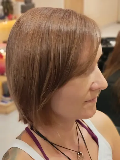 A side profile of the sleek bob, showing the clean angle and smooth finish of the haircut.