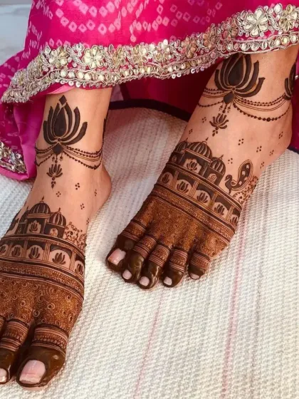 A stunning foot mehendi design featuring a skyline of royal architecture on the feet and delicate lotus anklets.