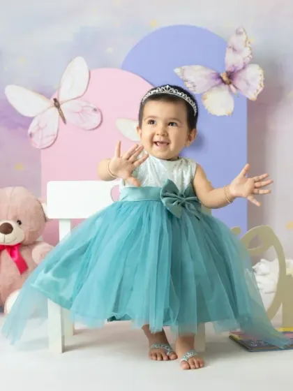 A magical unicorn and butterfly theme for a first birthday. The pastel colors, whimsical props, and dreamy backdrop create a true fairy tale setting.