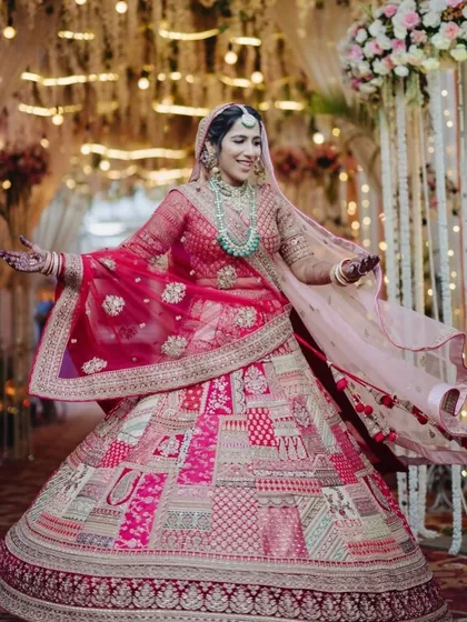 A joyful twirl from the bride in her unique patchwork lehenga. Her radiant makeup matches her vibrant personality.