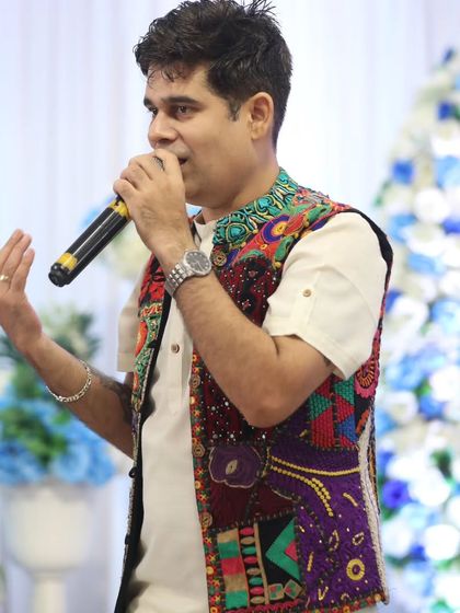 A classic emcee pose, speaking to the audience. Whether it's a large crowd or an intimate gathering, my delivery is always clear and engaging.